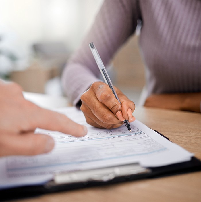 A patient filling out forms