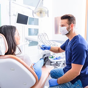 Dentist and patient talking in dental office