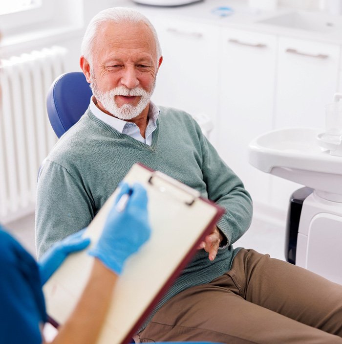 a patient speaking with a dentist