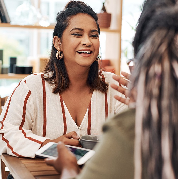 a woman having coffee with a friend