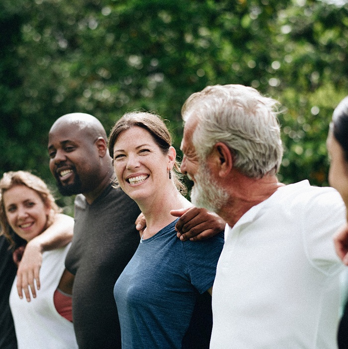 Invisalign patient smiling with friends