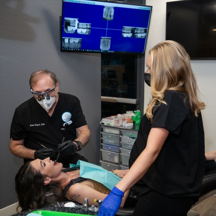 Dentist and assistant performing root canal treatment in Scottsdale