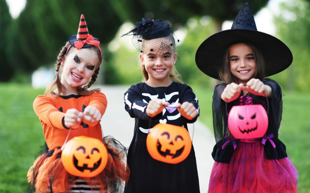 Three children trick-or-treating.